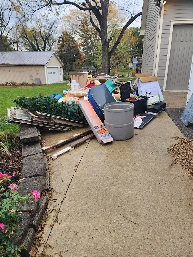 Dumpster being loaded with debris for Estate Cleanout Dumpster Rental in Plumstead